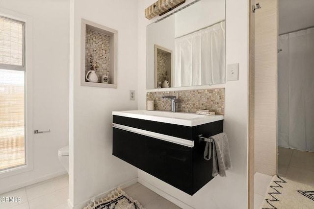 54667 Benecia Trl, Yucca Valley, CA 92284 - bathroom featuring tile patterned flooring, vanity, decorative backsplash, and a shower with shower curtain