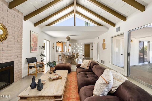 54667 Benecia Trl, Yucca Valley, CA 92284 - living room featuring a brick fireplace and baseboards