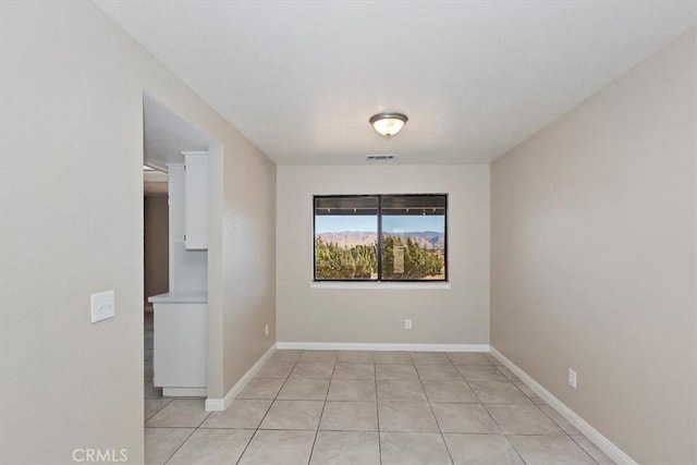 7267 Dalscote St, Hesperia, CA 92345 - spare room with light tile patterned floors and baseboards
