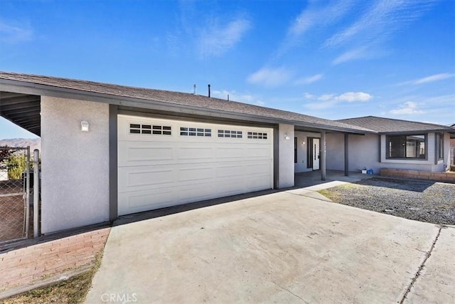 7267 Dalscote St, Hesperia, CA 92345 - view of front of home with driveway, stucco siding, and a garage