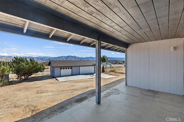 7267 Dalscote St, Hesperia, CA 92345 - view of patio / terrace featuring a mountain view, an outdoor structure, and a detached garage