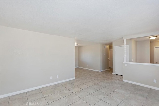 7267 Dalscote St, Hesperia, CA 92345 - unfurnished room featuring a textured ceiling and light tile patterned flooring