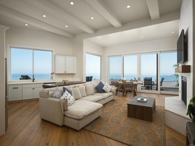 211 Mar De Cortez, Avalon, CA 90704 - living room featuring beamed ceiling, healthy amount of natural light, light wood-style flooring, recessed lighting, and a high end fireplace