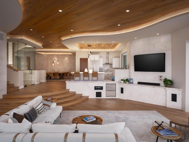 211 Mar De Cortez, Avalon, CA 90704 - living room featuring wooden ceiling, a raised ceiling, recessed lighting, light wood-style flooring, and stairs