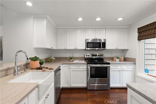 51 Sea Pine Ln, Newport Beach, CA 92660 - kitchen featuring appliances with stainless steel finishes, light countertops, dark wood-style floors, white cabinets, and recessed lighting