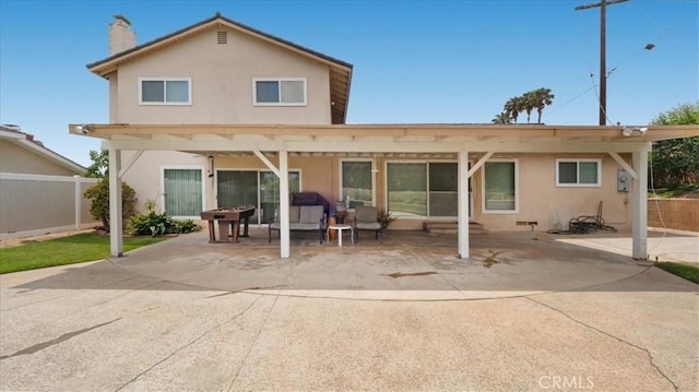 860 Knollwood Dr, Corona, CA 92882 - back of property with a patio area, stucco siding, and a chimney
