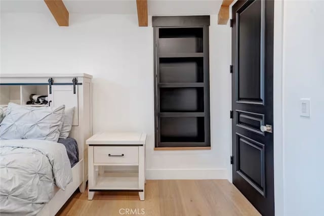5225 Topeka Dr, Tarzana, CA 91356 - bedroom featuring beam ceiling and light wood-style floors