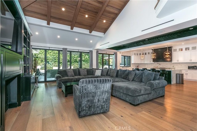 5225 Topeka Dr, Tarzana, CA 91356 - living room featuring high vaulted ceiling, light wood-style floors, a wooden ceiling with exposed beams, and recessed lighting