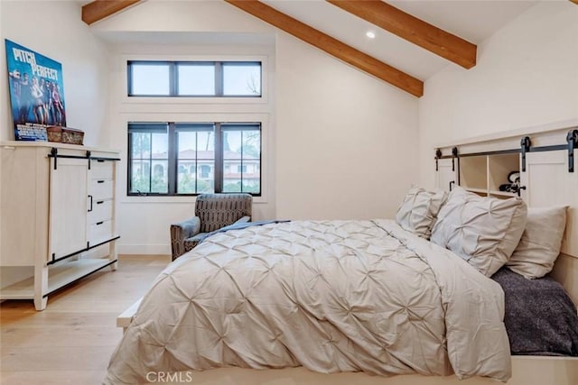 5225 Topeka Dr, Tarzana, CA 91356 - bedroom with a barn door, beam ceiling, light wood finished floors, recessed lighting, and high vaulted ceiling