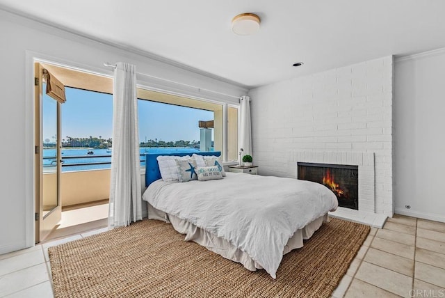 3366 Bayside Walk, San Diego, CA 92109 - bedroom with tile patterned floors, a brick fireplace, and crown molding