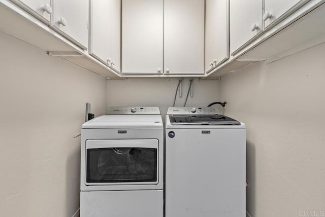 3366 Bayside Walk, San Diego, CA 92109 - laundry area with washer and clothes dryer and cabinet space