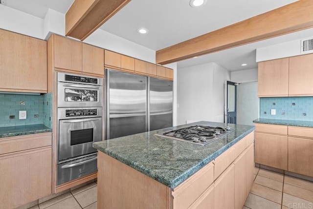 3366 Bayside Walk, San Diego, CA 92109 - kitchen featuring a warming drawer, appliances with stainless steel finishes, beam ceiling, light tile patterned flooring, and decorative backsplash