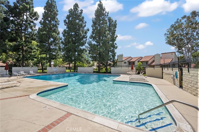18325 Gum Tree Ln, Huntington Beach, CA 92646 - community pool with a patio area