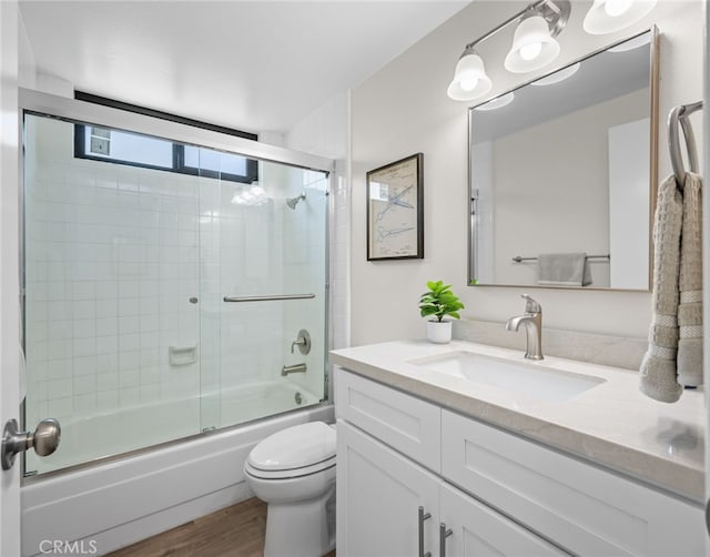 18325 Gum Tree Ln, Huntington Beach, CA 92646 - full bathroom featuring vanity, combined bath / shower with glass door, and wood finished floors