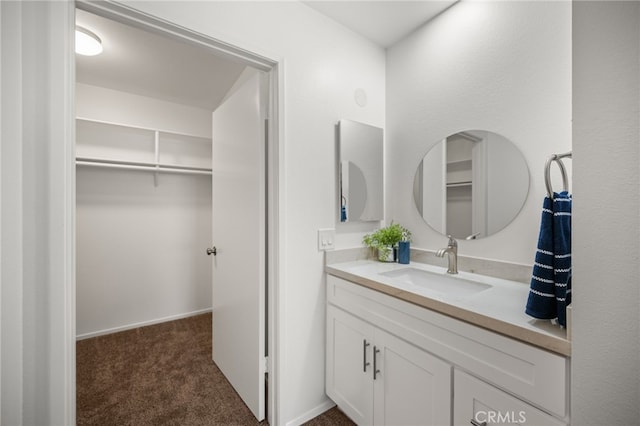 18325 Gum Tree Ln, Huntington Beach, CA 92646 - bathroom with vanity and a walk in closet