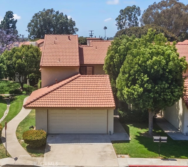18325 Gum Tree Ln, Huntington Beach, CA 92646 - view of front of property with a tile roof, a garage, stucco siding, and a front lawn
