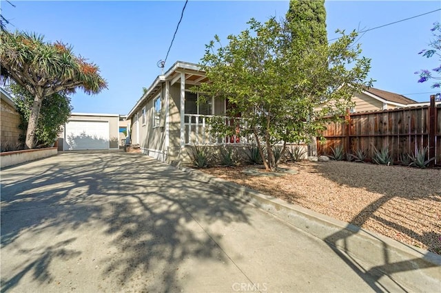 936 Gonzales St, Placentia, CA 92870 - view of front of house featuring concrete driveway, a garage, an outdoor structure, and stucco siding