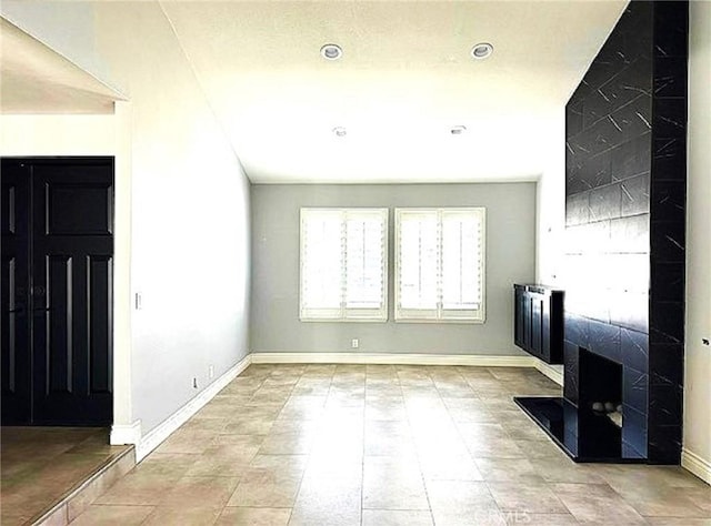 1063 Redding Ave, Costa Mesa, CA 92626 - unfurnished living room with baseboards and a wood stove