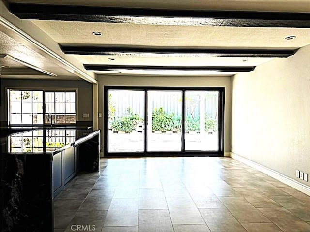 1063 Redding Ave, Costa Mesa, CA 92626 - tiled empty room featuring healthy amount of natural light and beam ceiling