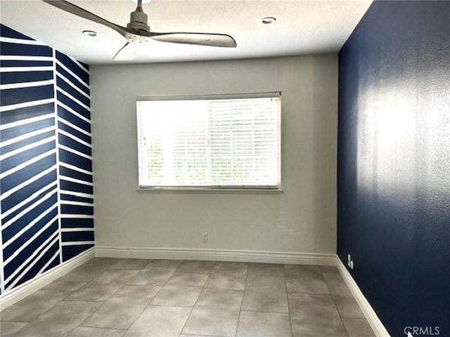 1063 Redding Ave, Costa Mesa, CA 92626 - empty room with ceiling fan, tile patterned flooring, and a textured ceiling