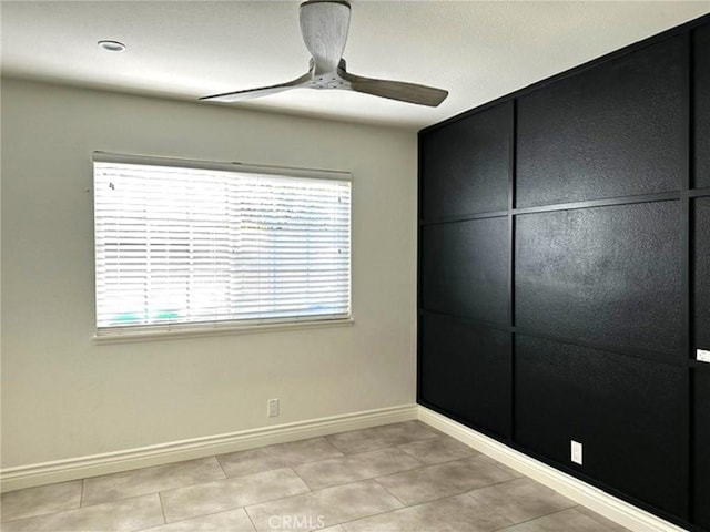 1063 Redding Ave, Costa Mesa, CA 92626 - unfurnished bedroom with light tile patterned floors and ceiling fan