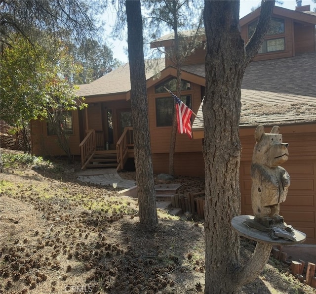 2701 Hillcrest Ct, Frazier Park, CA 93225 - back of house featuring a shingled roof and a garage