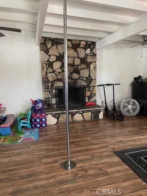 1408 S Central Ave, Compton, CA 90220 - detailed view of ceiling fan, beam ceiling, wood finished floors, and a fireplace