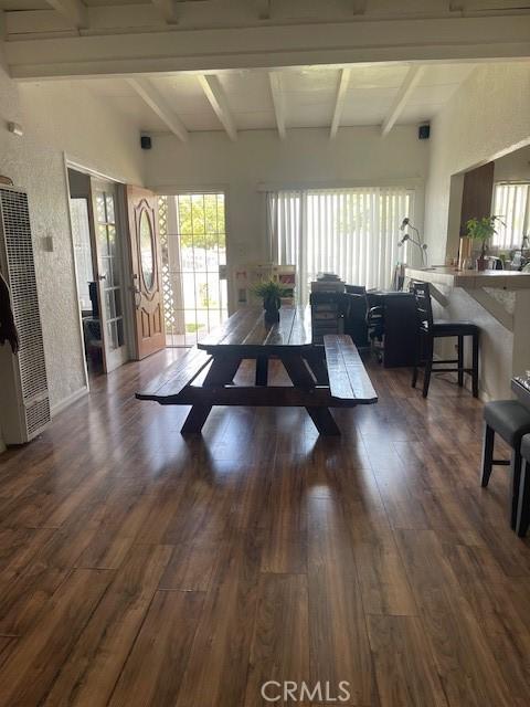 1408 S Central Ave, Compton, CA 90220 - living area featuring a heating unit, wood finished floors, and beamed ceiling