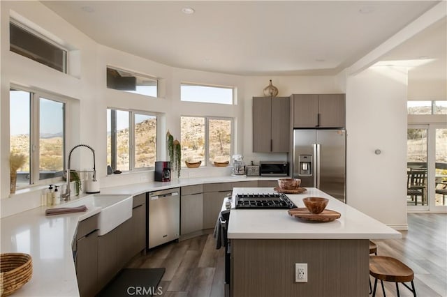 59855 Security Dr, Yucca Valley, CA 92284 - kitchen with stainless steel appliances, a breakfast bar, a center island, light wood-type flooring, and recessed lighting