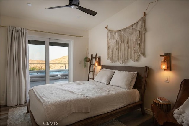 59855 Security Dr, Yucca Valley, CA 92284 - bedroom featuring wood finished floors, a ceiling fan, vaulted ceiling, and access to exterior