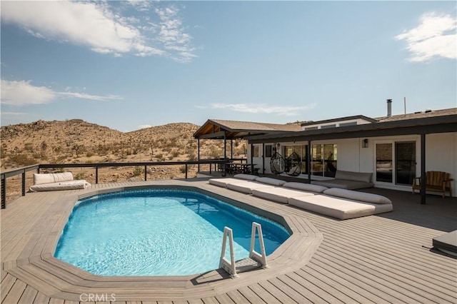 59855 Security Dr, Yucca Valley, CA 92284 - view of pool featuring a deck with mountain view and an outdoor living space