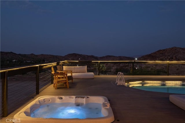 59855 Security Dr, Yucca Valley, CA 92284 - pool at night featuring a deck with mountain view