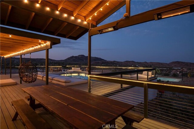 59855 Security Dr, Yucca Valley, CA 92284 - wooden terrace with a jacuzzi, a mountain view, and an outdoor pool