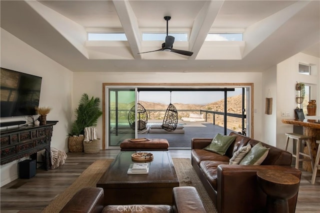 59855 Security Dr, Yucca Valley, CA 92284 - living room with wood finished floors, a skylight, ceiling fan, beamed ceiling, and a high ceiling