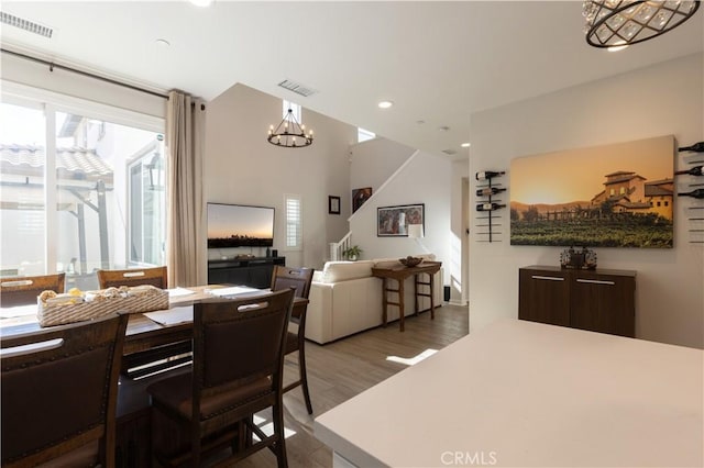 45055 Via Vela, Temecula, CA 92592 - dining area with a chandelier, stairs, wood finished floors, and recessed lighting