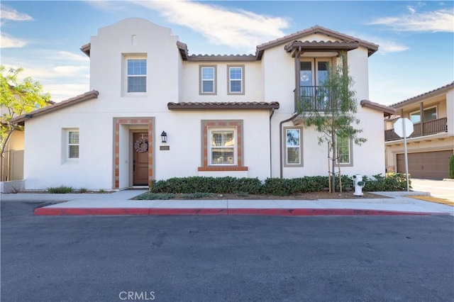 45055 Via Vela, Temecula, CA 92592 - mediterranean / spanish-style home featuring stucco siding, a tiled roof, and a balcony