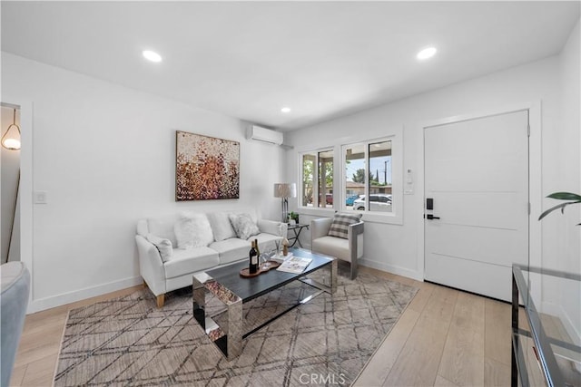 16082 Athol St, Fontana, CA 92335 - living room featuring a wall mounted air conditioner, light wood-style floors, and recessed lighting