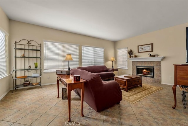 2631 Harvest Crest Ln, Corona, CA 92881 - tiled living area featuring a tiled fireplace and baseboards