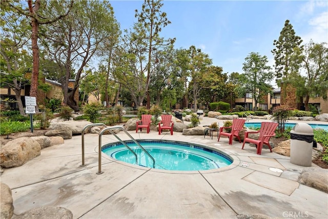 12750 Centralia St Unit 159, Lakewood, CA 90715 - view of pool featuring a pool and a patio area