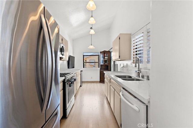 12750 Centralia St Unit 159, Lakewood, CA 90715 - kitchen featuring appliances with stainless steel finishes, plenty of natural light, light wood-style floors, and light countertops