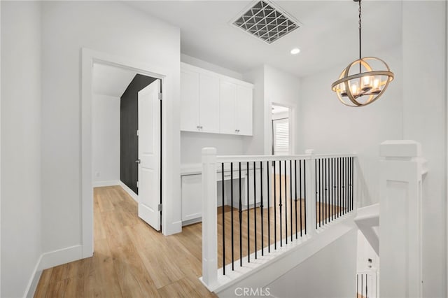 6508 Alondra Blvd, Paramount, CA 90723 - corridor featuring an upstairs landing, a chandelier, light wood-type flooring, and recessed lighting