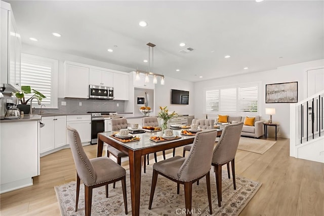 6508 Alondra Blvd, Paramount, CA 90723 - dining space with recessed lighting, light wood-style floors, and stairs