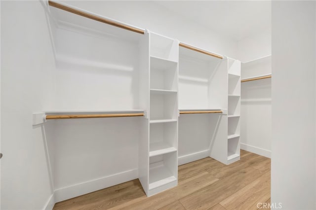 6508 Alondra Blvd, Paramount, CA 90723 - walk in closet featuring wood finished floors