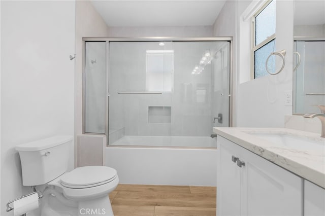 6508 Alondra Blvd, Paramount, CA 90723 - full bathroom with vanity, wood finished floors, and shower / bath combination with glass door