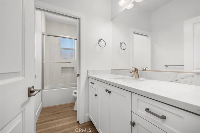 6508 Alondra Blvd, Paramount, CA 90723 - bathroom with vanity, wood finished floors, and shower / tub combination