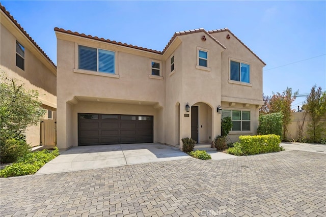 6508 Alondra Blvd, Paramount, CA 90723 - mediterranean / spanish-style home featuring stucco siding, driveway, a garage, and a tiled roof