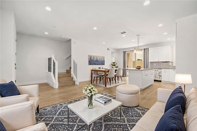 6508 Alondra Blvd, Paramount, CA 90723 - living area with stairs, light wood-style flooring, and recessed lighting