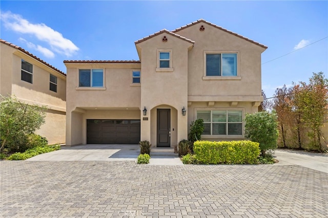 6508 Alondra Blvd, Paramount, CA 90723 - view of front of house with decorative driveway, a garage, stucco siding, and a tile roof