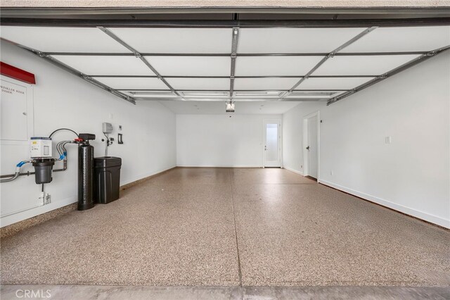 6508 Alondra Blvd, Paramount, CA 90723 - garage with baseboards and a central vacuum unit
