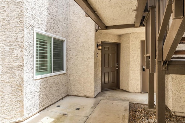 72 Corniche Dr Unit C, Dana Point, CA 92629 - doorway to property with stucco siding